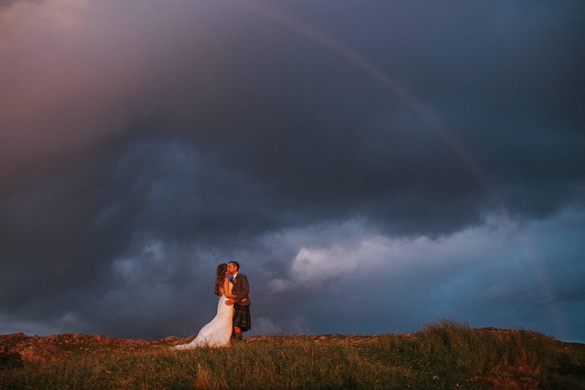 rainbow wedding bride groom kiss
